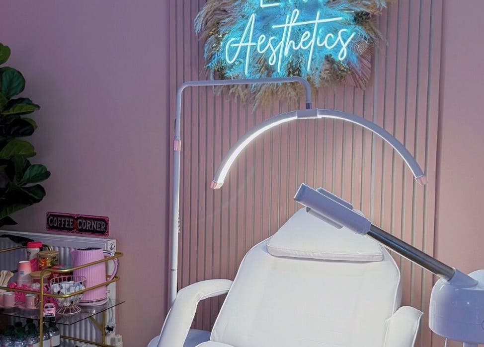 Relaxing treatment room at LM Aesthetics, Oldham, England, GB with soothing lighting and plush seating.