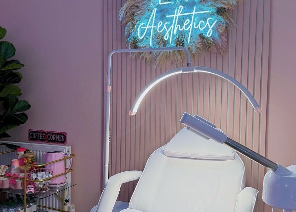 Relaxing treatment room at LM Aesthetics, Oldham, England, GB with soothing lighting and plush seating.