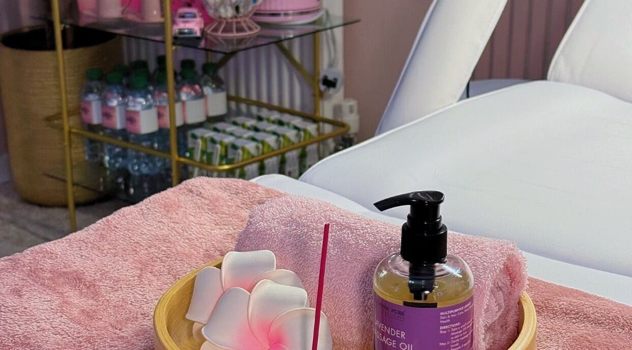 Lavender massage oil and towels at LM Aesthetics in Oldham, England, GB create a serene spa atmosphere.