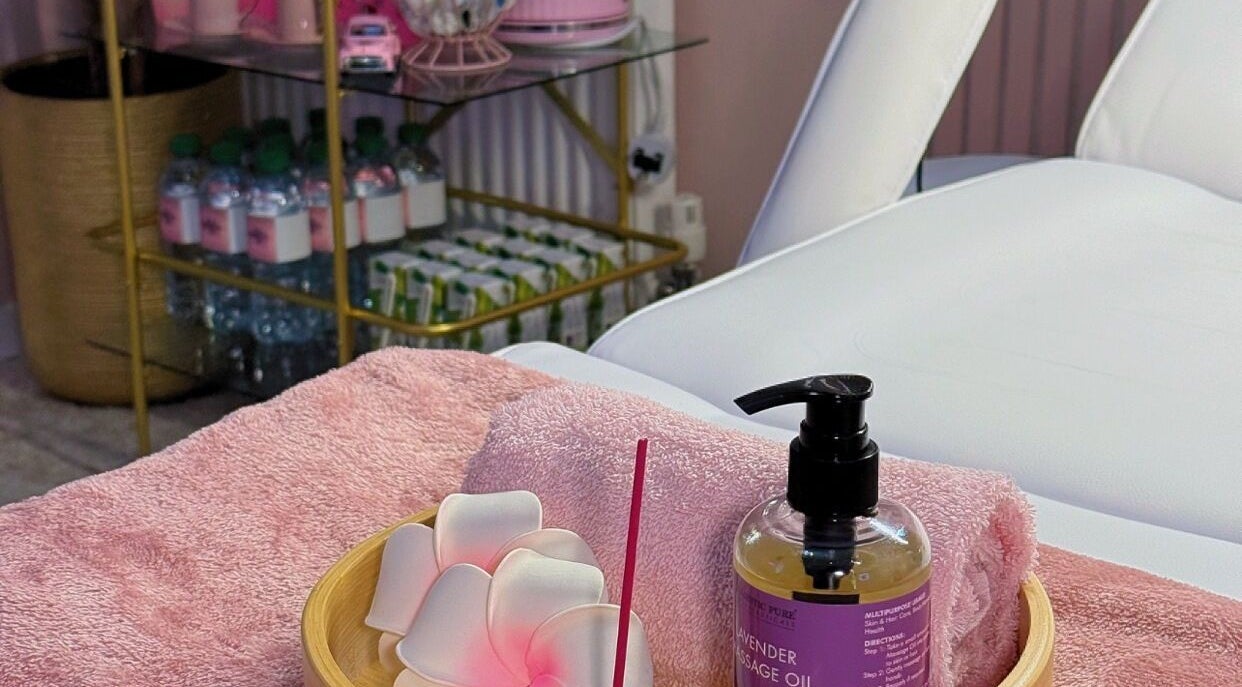 Lavender massage oil and towels at LM Aesthetics in Oldham, England, GB create a serene spa atmosphere.
