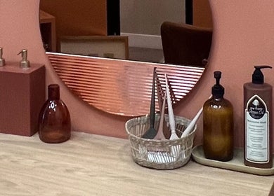 Stylish vanity surface at The Vibe Cove, Tempe, Arizona, US featuring elegant decor and beauty products.