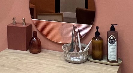 Stylish vanity surface at The Vibe Cove, Tempe, Arizona, US featuring elegant decor and beauty products.