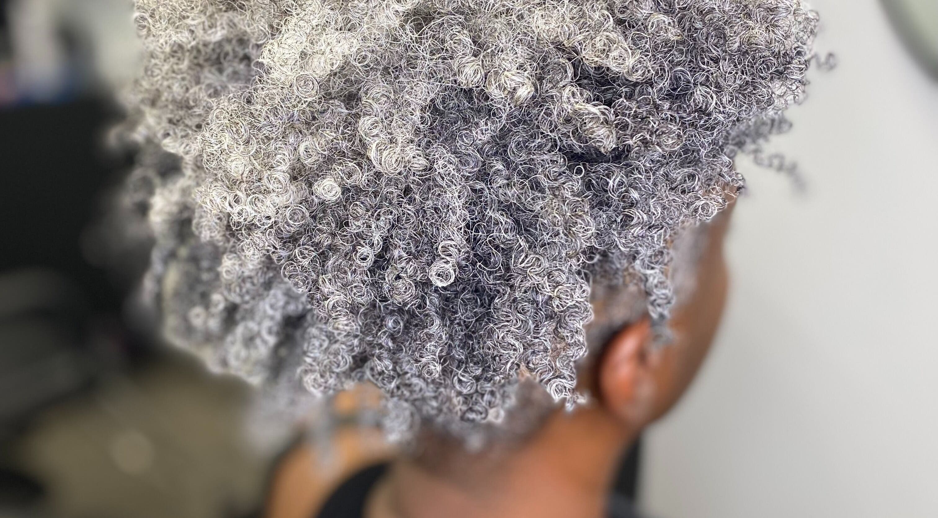 Elegant silver curly hair styled at the CURL Room, Mandeville, Manchester Parish, JM.