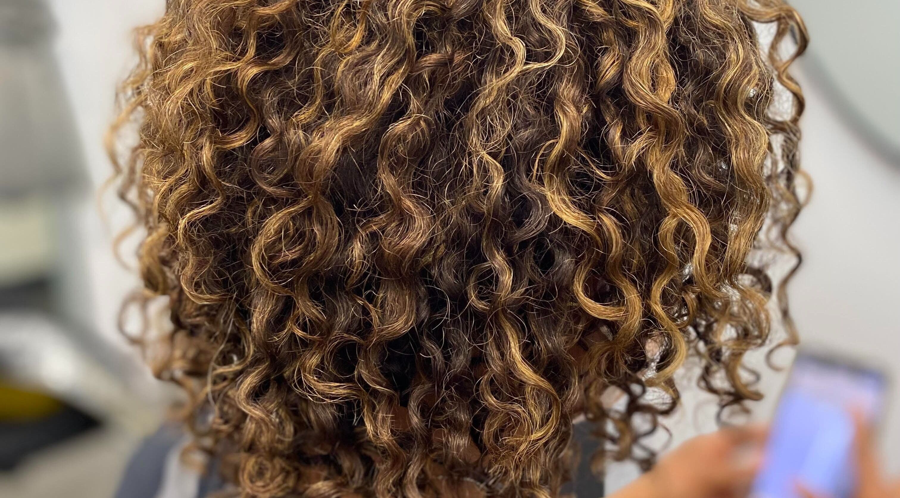 Lustrous curly hair styled at the CURL Room in Mandeville, Manchester Parish, JM.