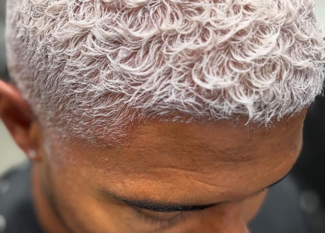 Close-up of stylish, dyed white curls at the CURL Room, Mandeville, Manchester Parish, JM.