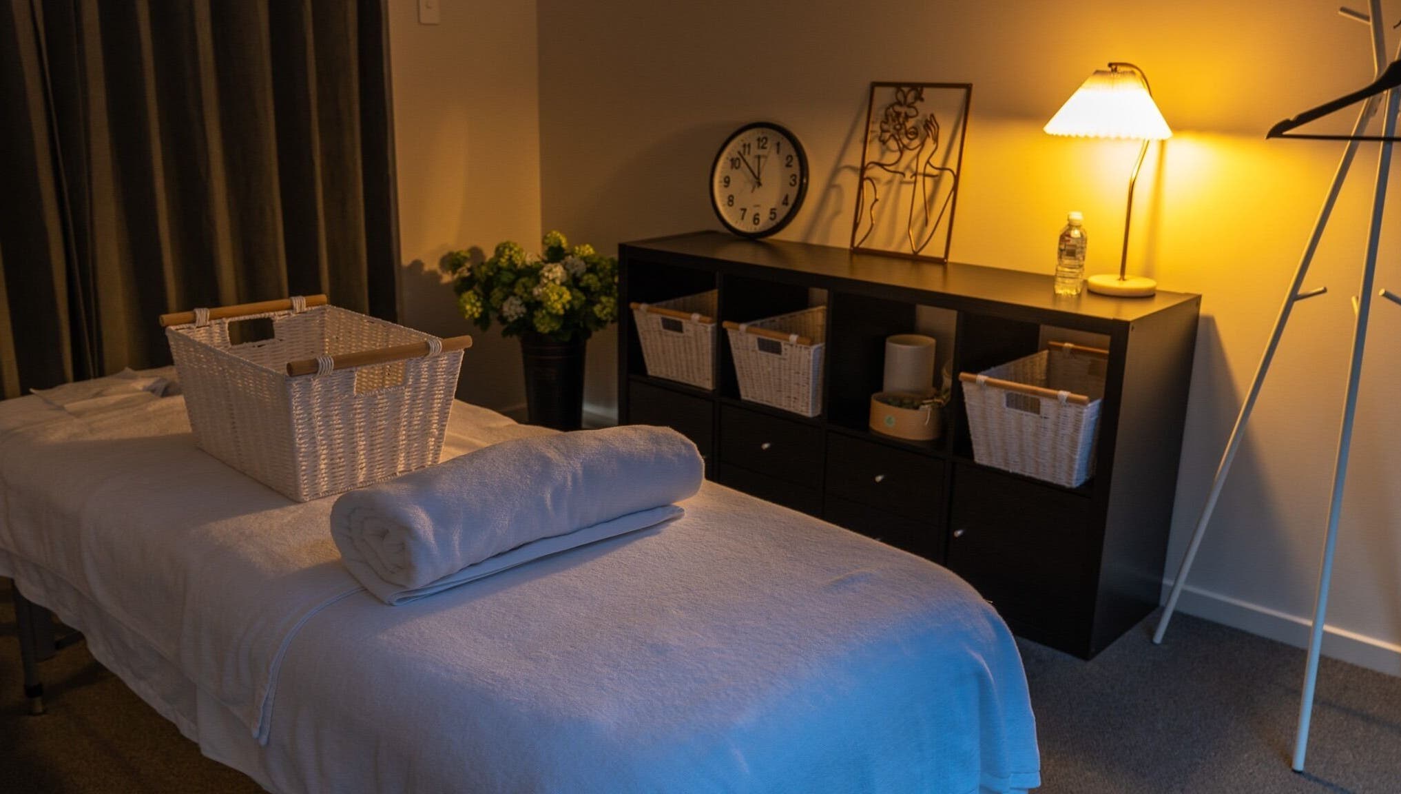 Cozy spa room at Youre Soul, Thornlands, Queensland, AU, with ambient lighting and massage table.