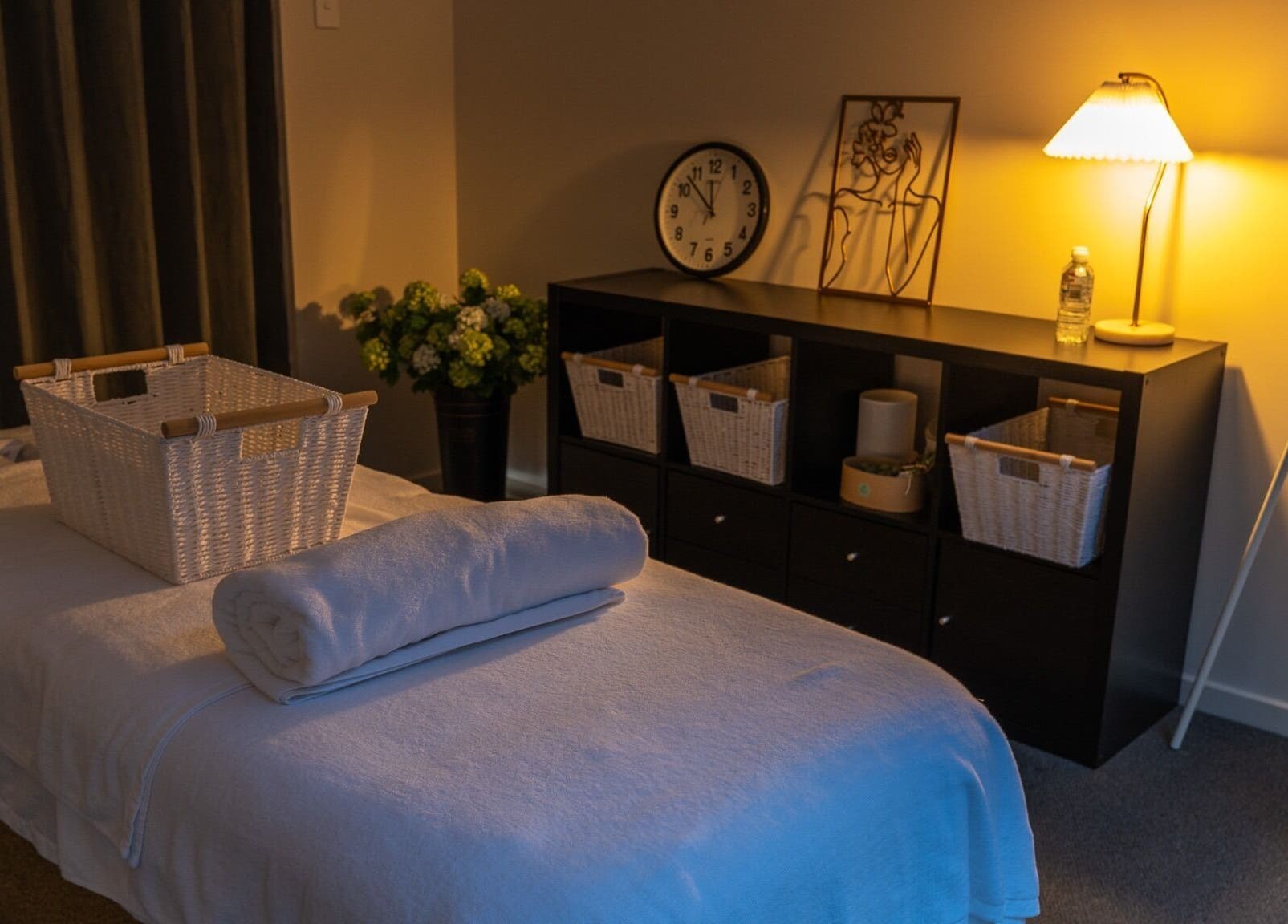 Cozy spa room at Youre Soul, Thornlands, Queensland, AU, with ambient lighting and massage table.