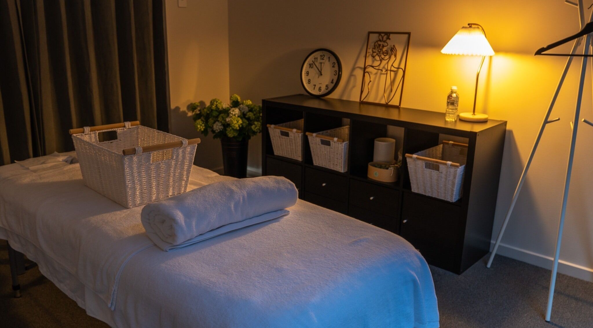 Cozy spa room at Youre Soul, Thornlands, Queensland, AU, with ambient lighting and massage table.