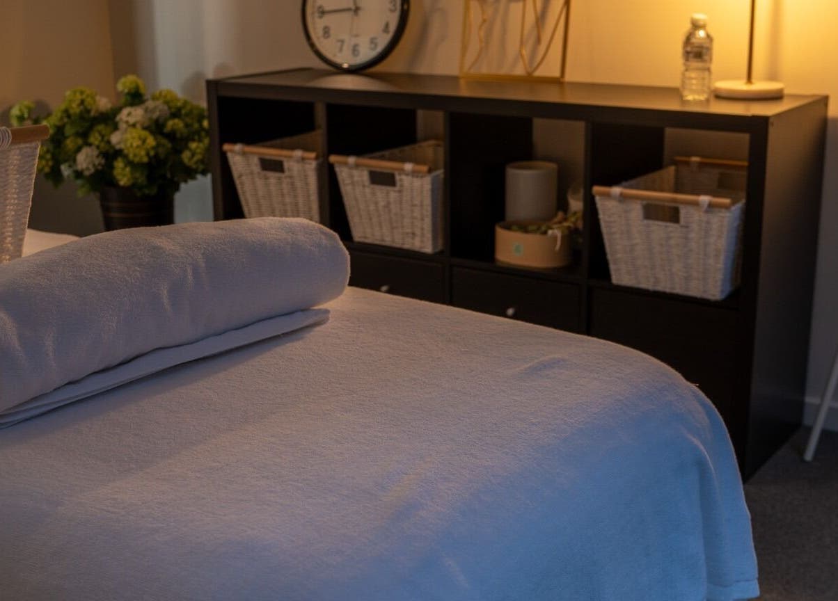 Tranquil spa room at Youre Soul, Thornlands, Queensland, AU with soft lighting and fluffy towels.