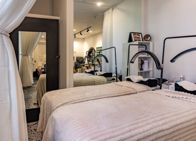 Cozy treatment room at Marvellous Nail & Beauty Spa, Melbourne, Victoria, AU with elegant decor and plush beds.
