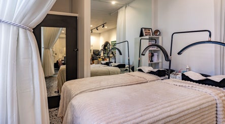 Cozy treatment room at Marvellous Nail & Beauty Spa, Melbourne, Victoria, AU with elegant decor and plush beds.