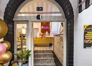 Entrance to Marvellous Nail & Beauty Spa in Melbourne, Victoria, AU with balloons and a grand opening sign.