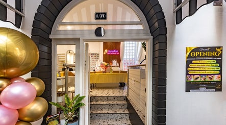 Entrance to Marvellous Nail & Beauty Spa in Melbourne, Victoria, AU with balloons and a grand opening sign.