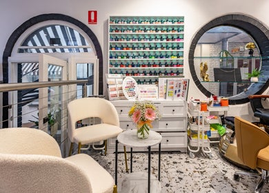 Elegant setup at Marvellous Nail & Beauty Spa, Melbourne, Victoria, AU showcasing chairs and nail polish display.