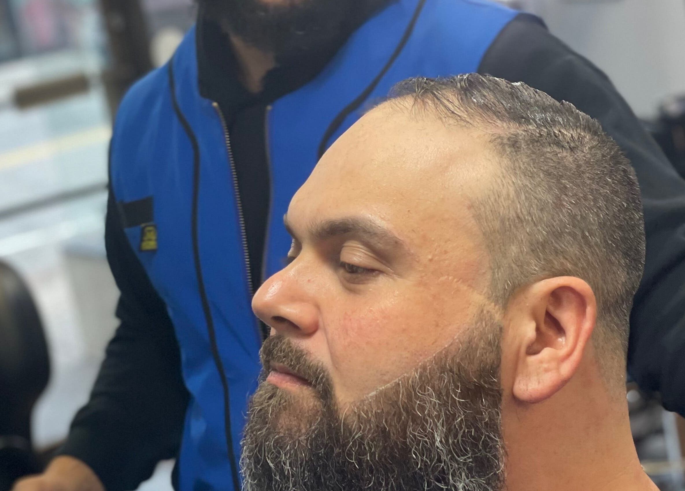 Client receiving precise beard trim at Luisthebarber-evolutionpatchogue, Patchogue, New York, US.