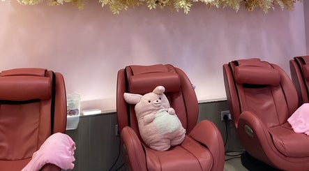Comfortable pink massage chairs at Nail Market Studio, Singapore, Singapore, SG with plush décor.