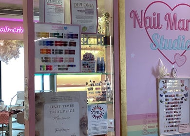 Entrance of Nail Market Studio featuring vibrant nail samples in Singapore, Singapore, SG.