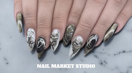 Intricate nail art at Nail Market Studio in Singapore, SG showcasing elegant designs and craftsmanship.