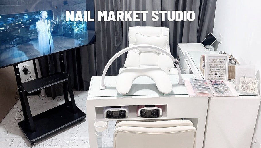 Nail Market Studio offers a sleek manicure station in Singapore, SG, featuring modern decor and tools.