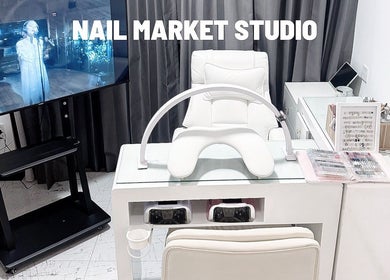 Nail Market Studio offers a sleek manicure station in Singapore, SG, featuring modern decor and tools.