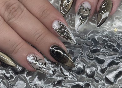 Intricate nail art with black and gold design at Nail Market Studio, Singapore, Singapore, SG.