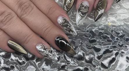 Intricate nail art with black and gold design at Nail Market Studio, Singapore, Singapore, SG.