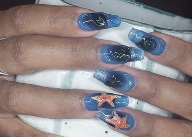 Stylish ocean-themed nails with starfish art at Nail Market Studio, Singapore, Singapore, SG.