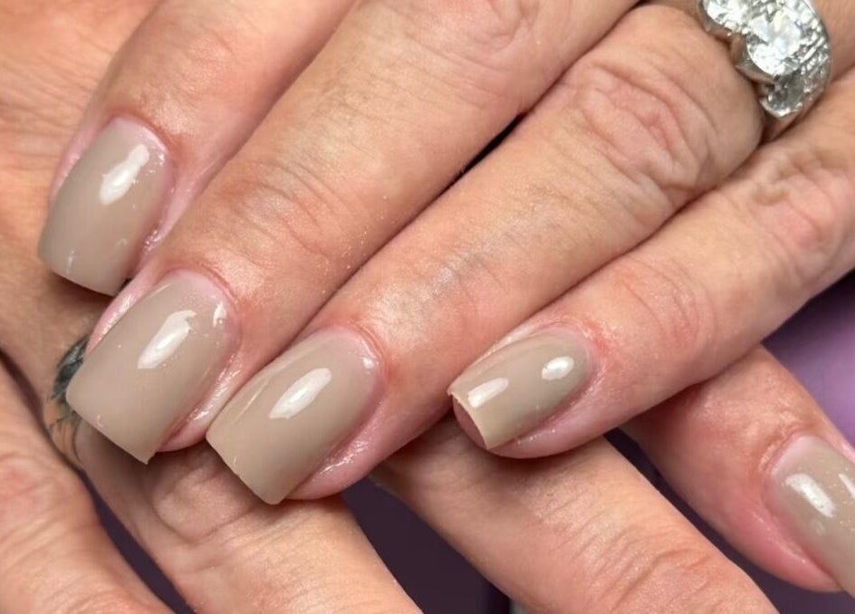 Elegant beige manicure at Ppsu Nails & Lashes Studio, Winnipeg, Manitoba, CA. Perfect for a sophisticated look.