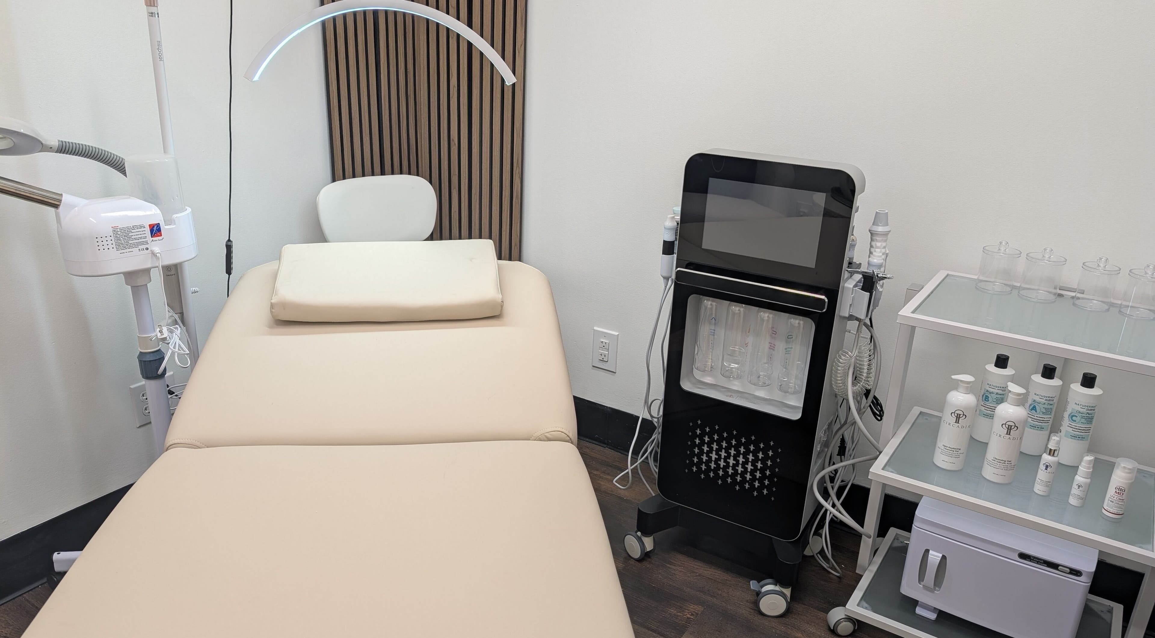 Luxury spa room at Great Skin MIA in Kendall, Florida, US, featuring modern equipment and a comfortable treatment bed.