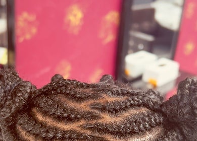 Intricate braided hairstyle at Diddy's Beauty & Wellness, London, England, GB.