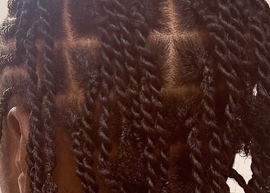 Twisted hair style at Diddy's Beauty & Wellness in London, England, GB, showcasing intricate designs.