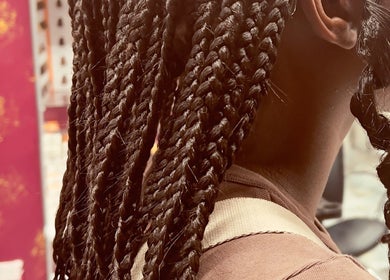 Intricate braids at Diddy's Beauty & Wellness in London, England, GB, showcasing expert styling.