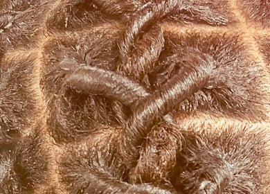 Close-up of intricate braiding at Diddy's Beauty & Wellness, London, England, GB.