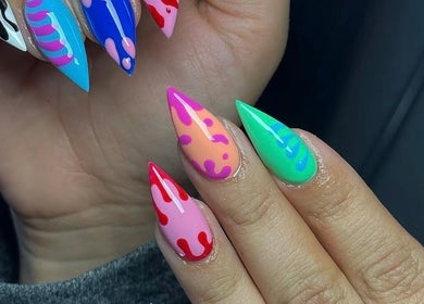 Colorful nail art at The Nail Room in North Branch, Minnesota, US, showcasing vibrant designs.