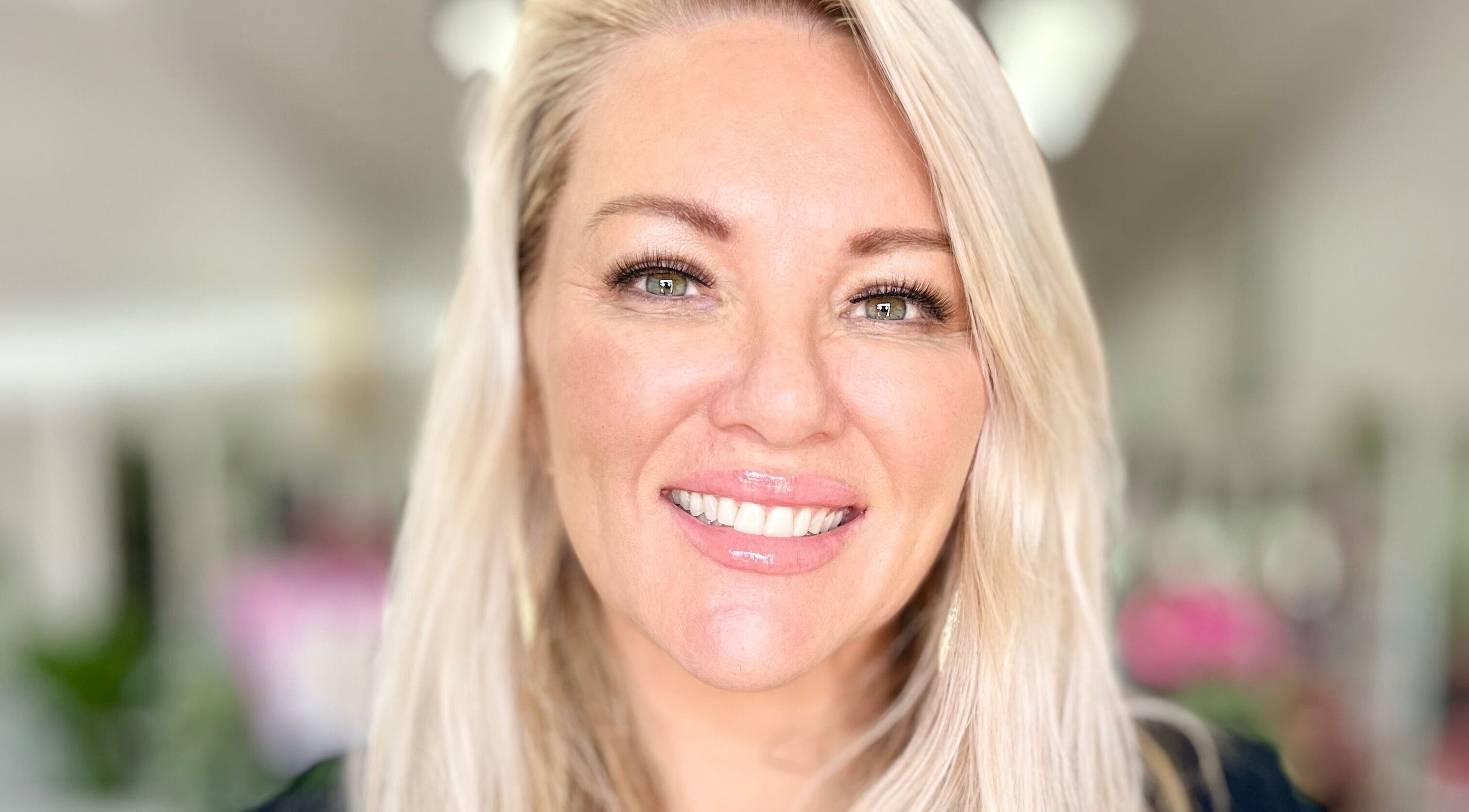 Client with a radiant smile at Hair & Beauty by Kelly Hays in Warrawong, New South Wales, AU.