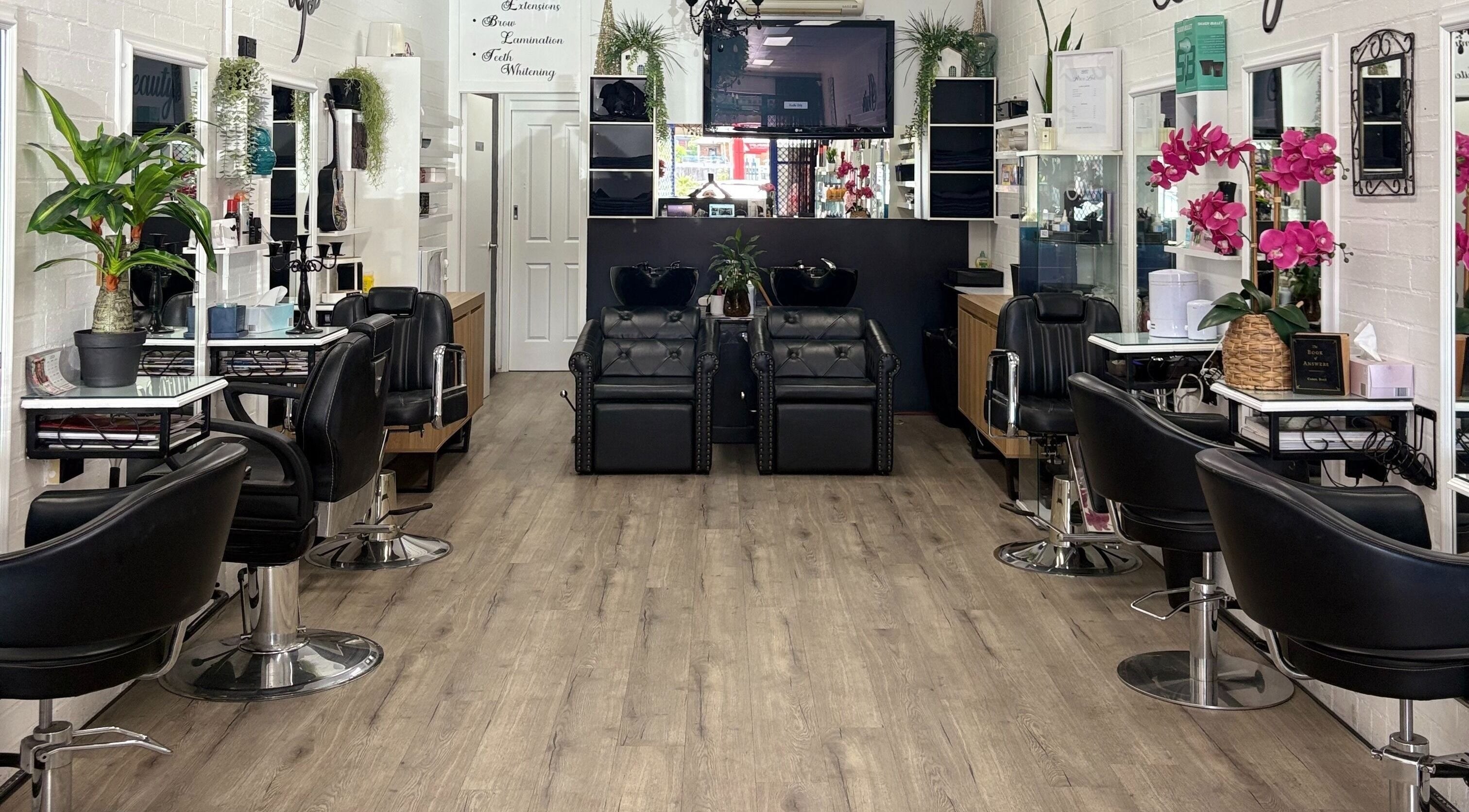 Chic salon at Hair & Beauty by Kelly Hays, Warrawong, New South Wales, AU with modern chairs and decor.