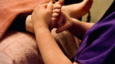 Foot massage at Reforkology in Sarn, Wales, GB, highlighting relaxation and wellness.