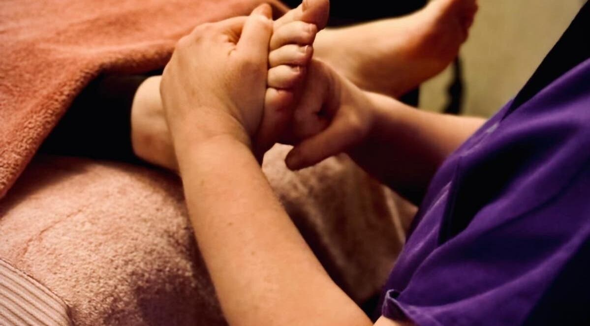 Foot massage at Reforkology in Sarn, Wales, GB, highlighting relaxation and wellness.