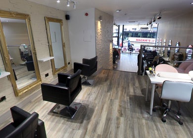 Sleek interior of Eleven Eleven Salon in Stirling, Scotland, GB with elegant mirrors and chairs.
