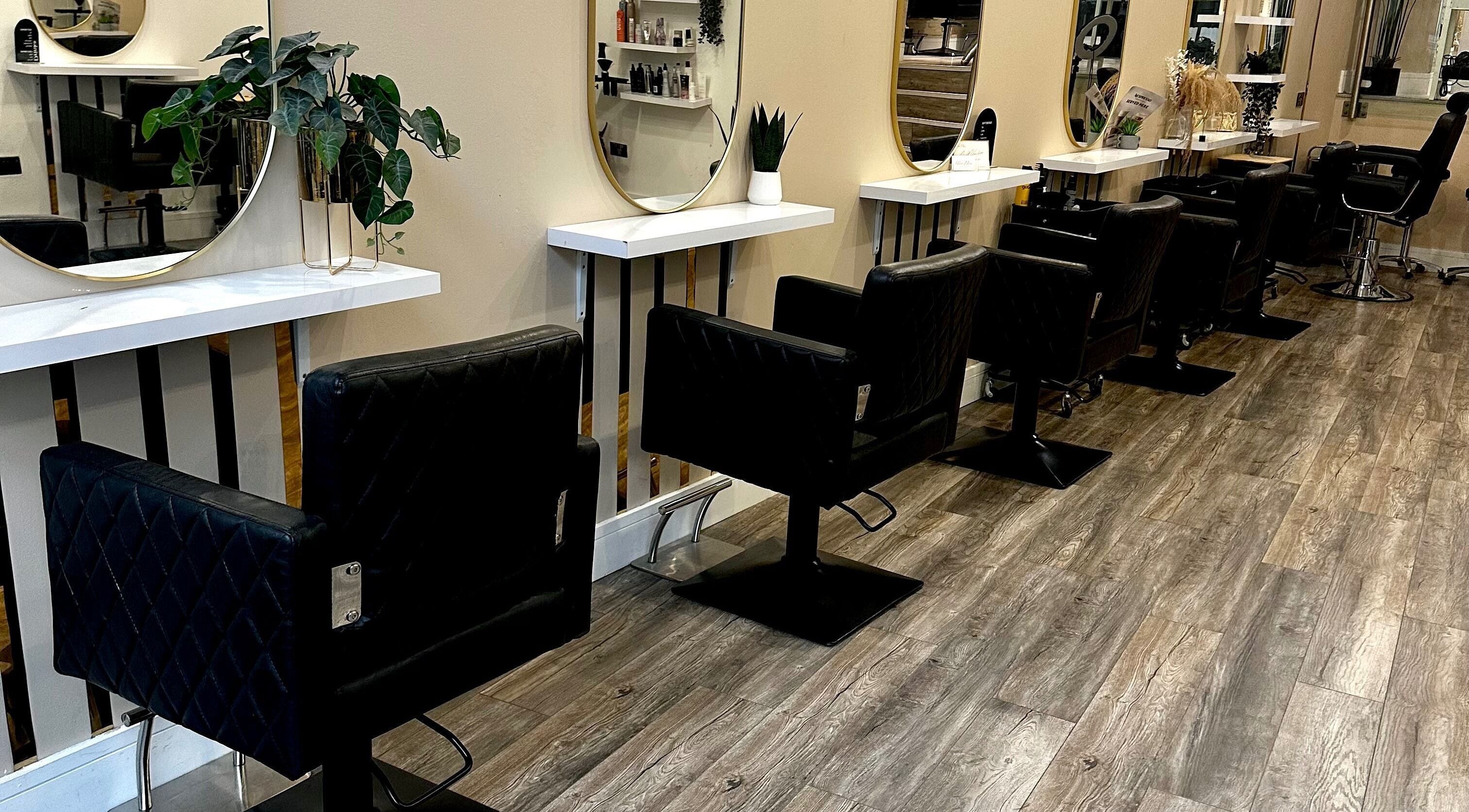 Elegant styling stations at Eleven Eleven Salon in Stirling, Scotland GB, featuring modern decor and mirrors.