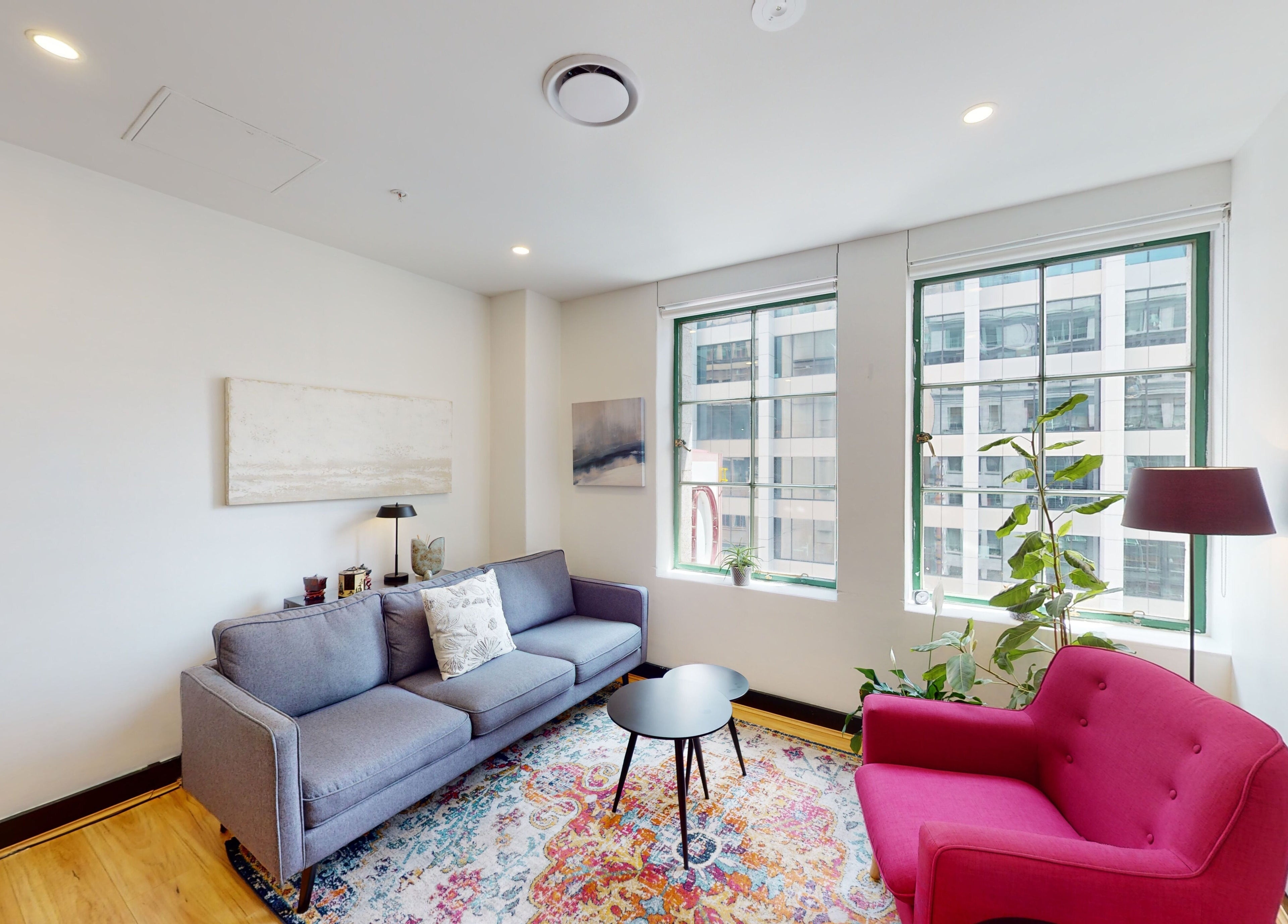 Cozy lounge at Feeling Space, Sydney, New South Wales, AU, with modern decor, bright windows, and plush seating.