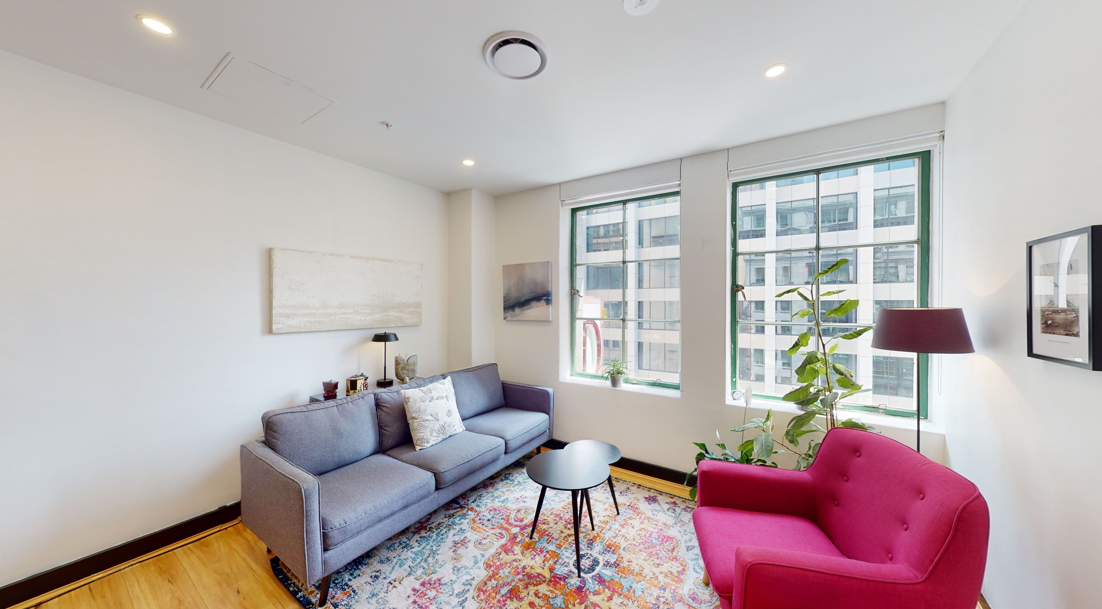 Cozy lounge at Feeling Space, Sydney, New South Wales, AU, with modern decor, bright windows, and plush seating.