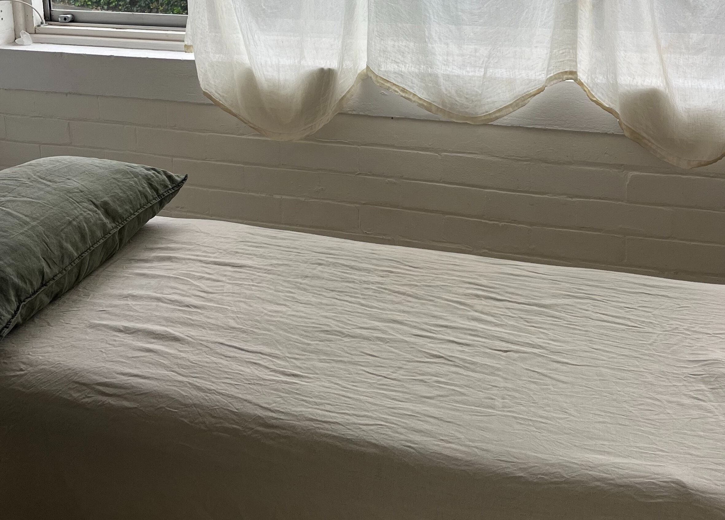 Cozy massage bed in natural light at Feeling Space - Manly, Manly, New South Wales, AU.