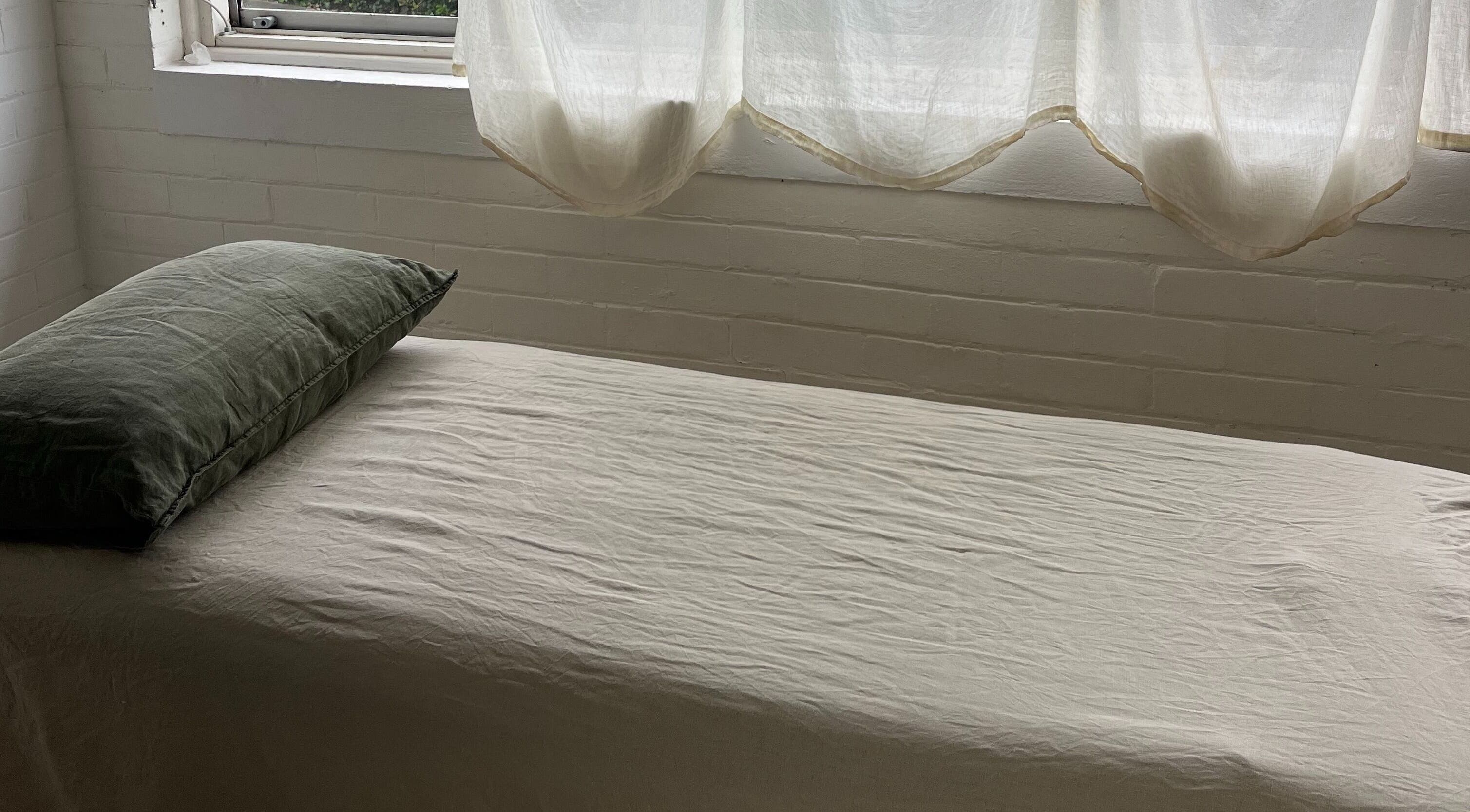 Cozy massage bed in natural light at Feeling Space - Manly, Manly, New South Wales, AU.