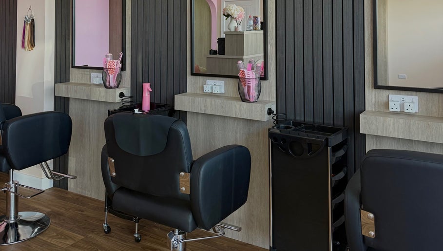Interior of Georgia Rose Hair Extensions salon in Bournemouth, England featuring stylish hair styling stations.
