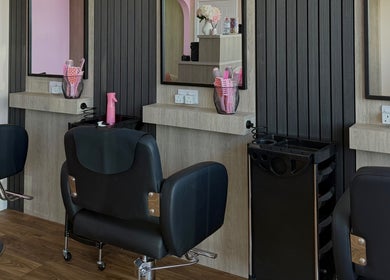 Interior of Georgia Rose Hair Extensions salon in Bournemouth, England featuring stylish hair styling stations.
