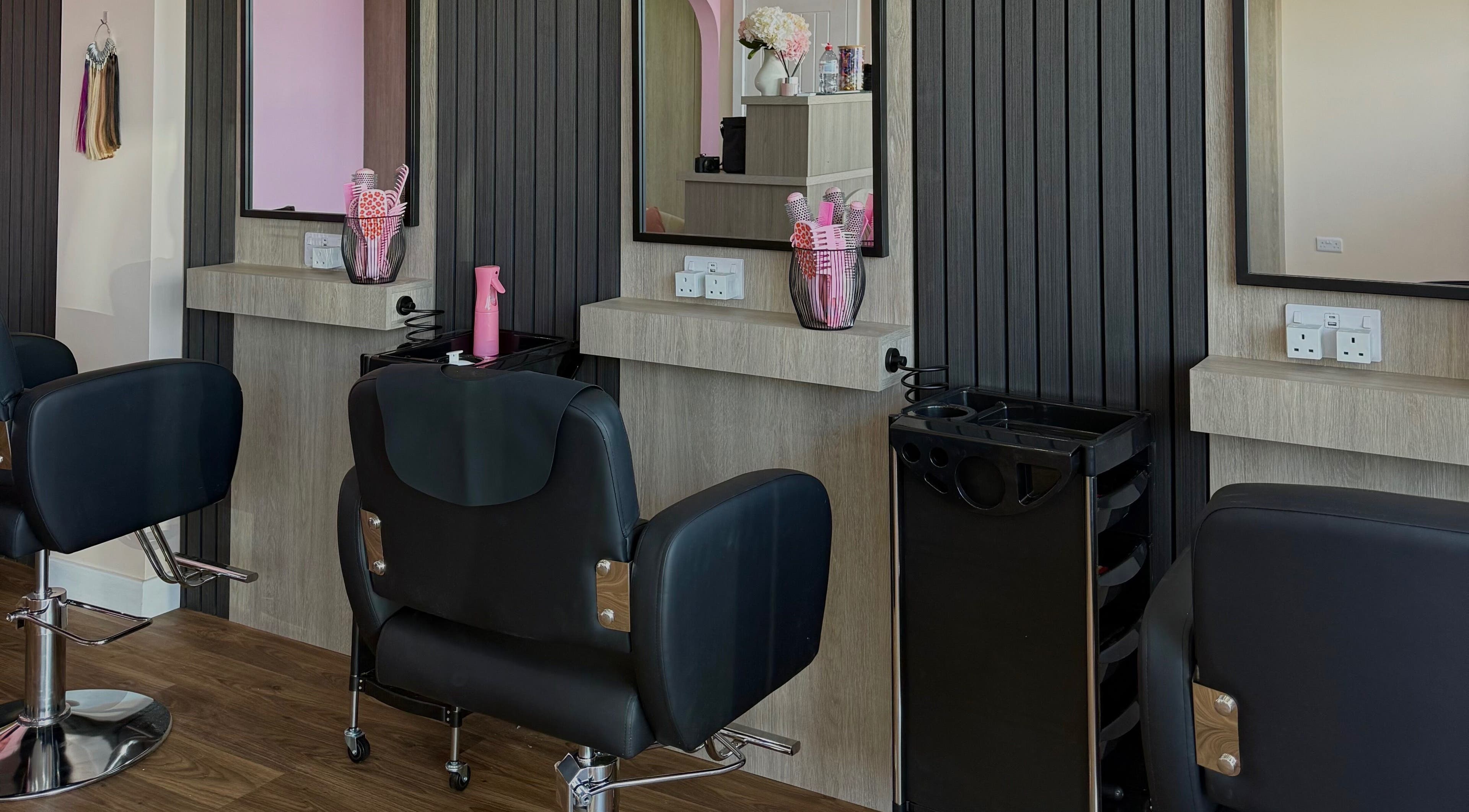 Interior of Georgia Rose Hair Extensions salon in Bournemouth, England featuring stylish hair styling stations.