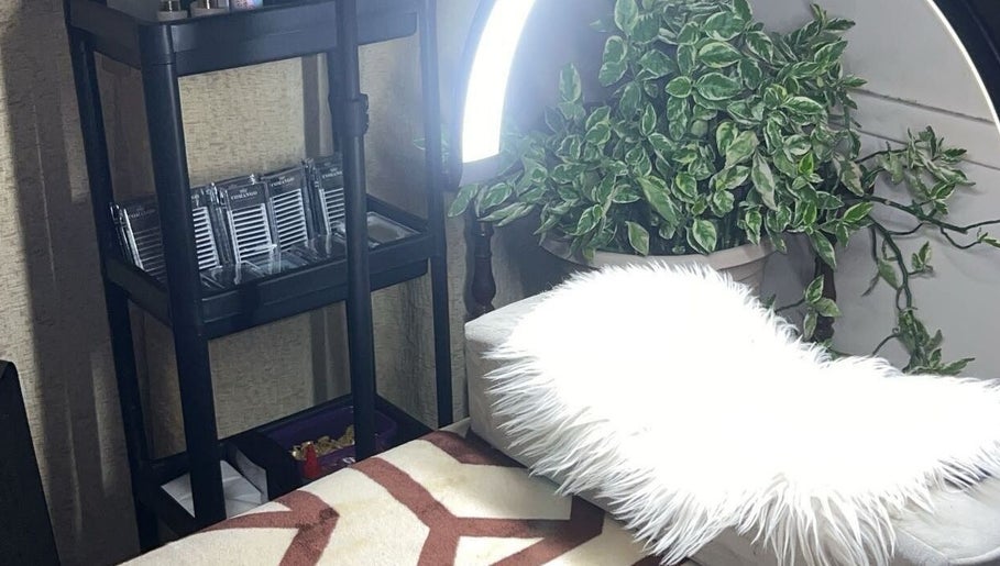 Cozy beauty setup at EyelashesByChanie, Paramaribo, Paramaribo, SR with plush decor and lash supplies.