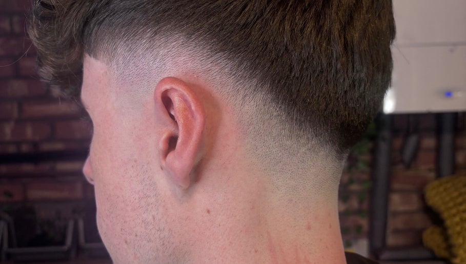 Crisp fade haircut at The Garage Chair, Cherry Burton, England, GB showcasing expert blending skills.