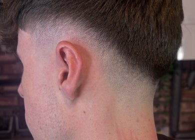 Crisp fade haircut at The Garage Chair, Cherry Burton, England, GB showcasing expert blending skills.